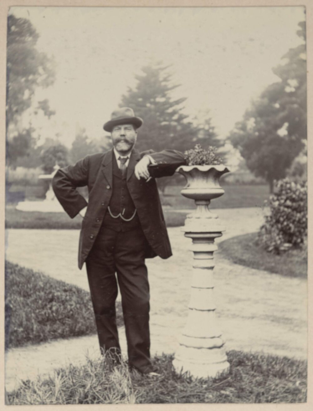 Avalon [man posing in garden]