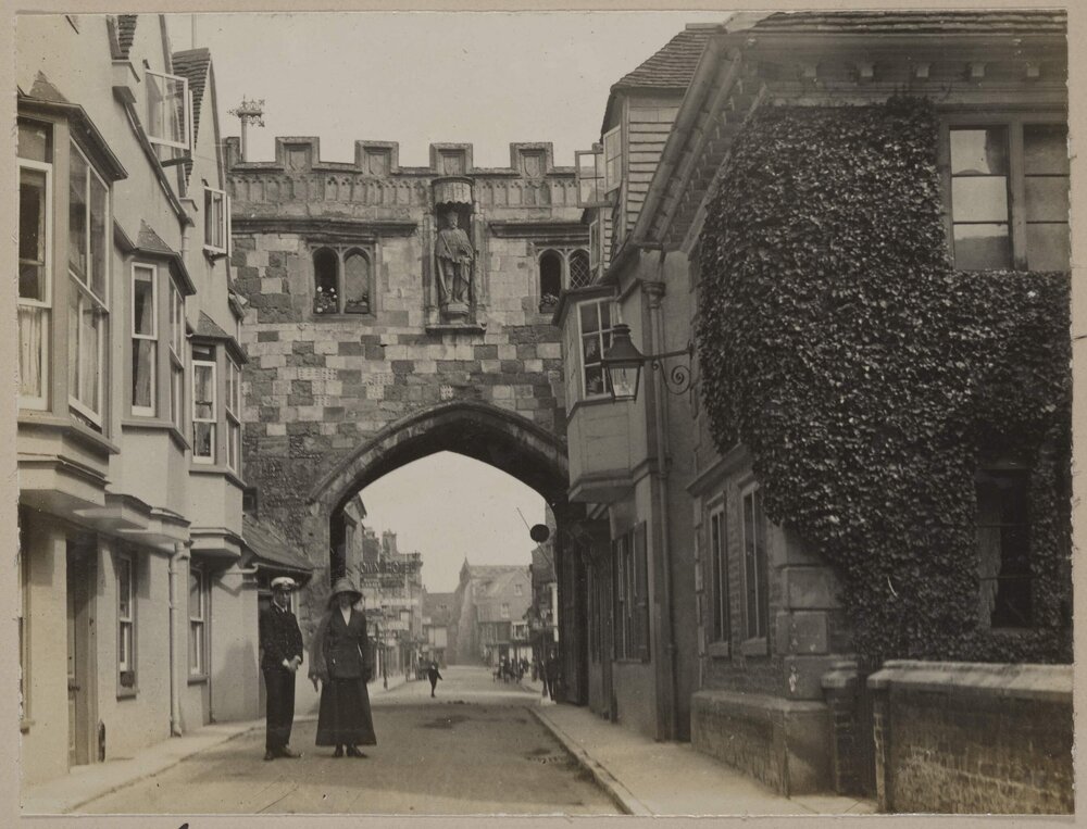Salisbury [man and woman in front of archway]