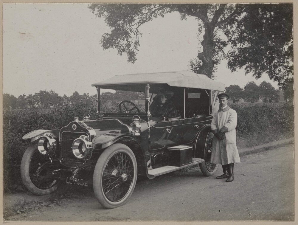 [Woman in motor vehicle]