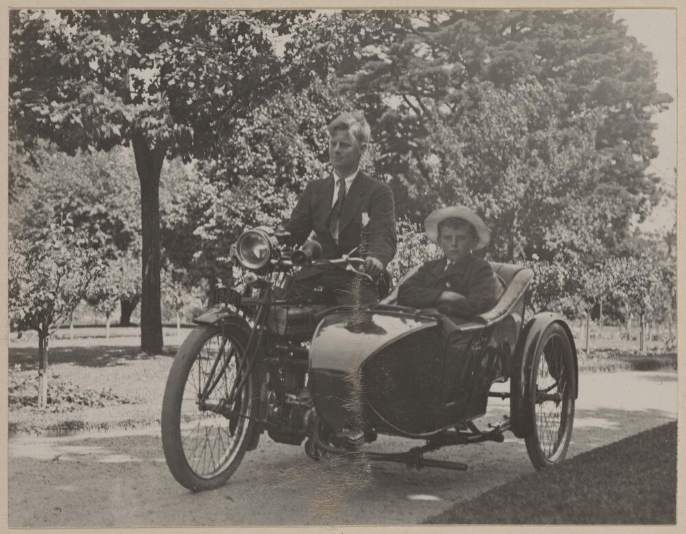 Miegunyah [man and boy on motor cycle with side car]