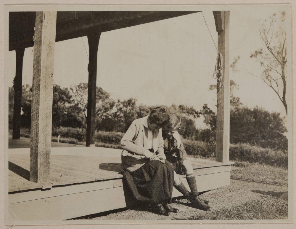 [Mabel Grimwade and boy seated on verandah at] Marathon