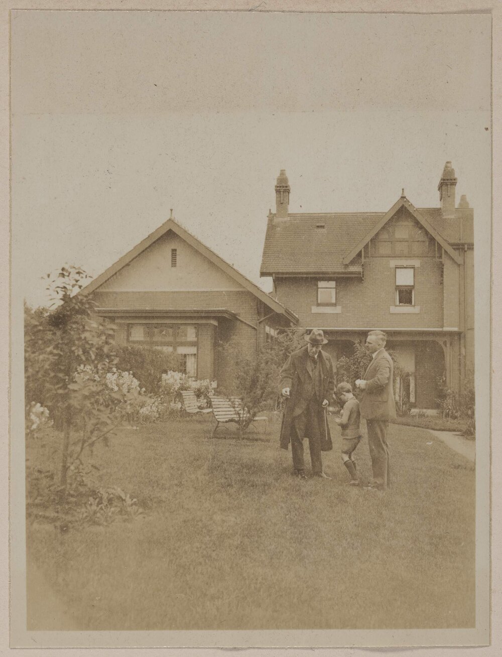 Geelong [two men and small child in front of house]