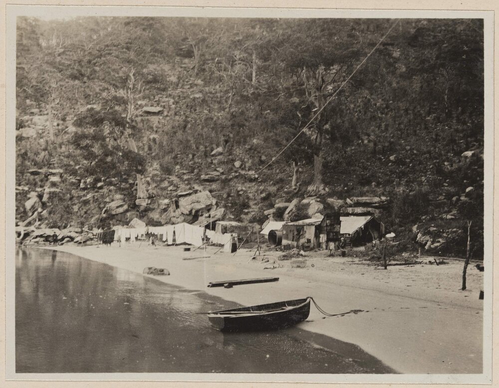 [Row boat moored on beach]