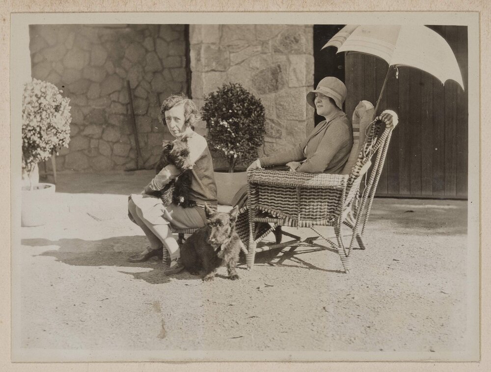 [Mabel Grimwade with dog and woman in garden chairs at Westerfield]