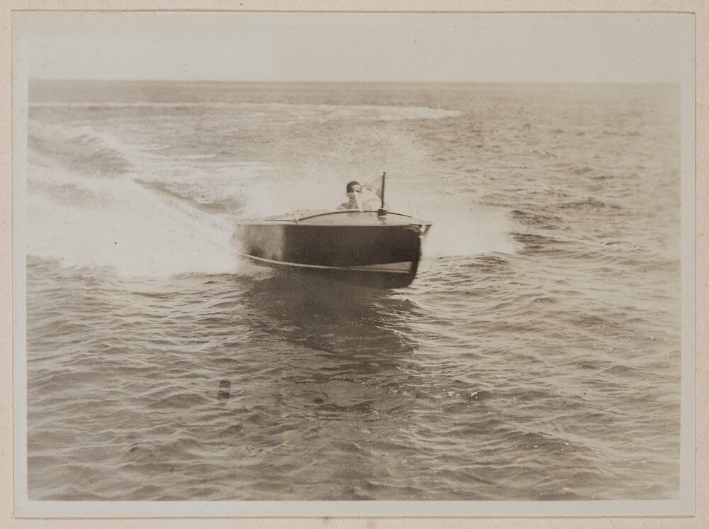 [Front veiw of driving motorboat]