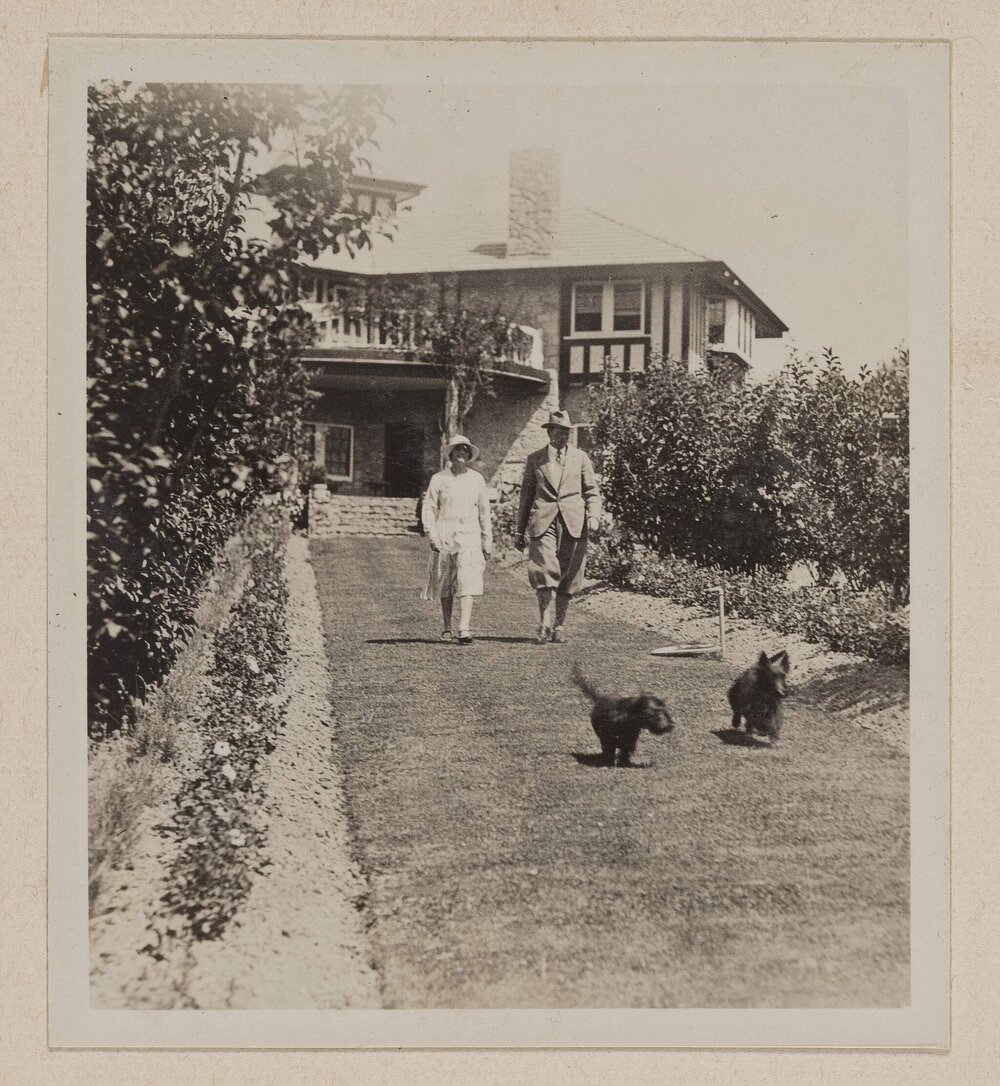 [Guests and dogs walking the main garden path] Westerfield Xmas 1930