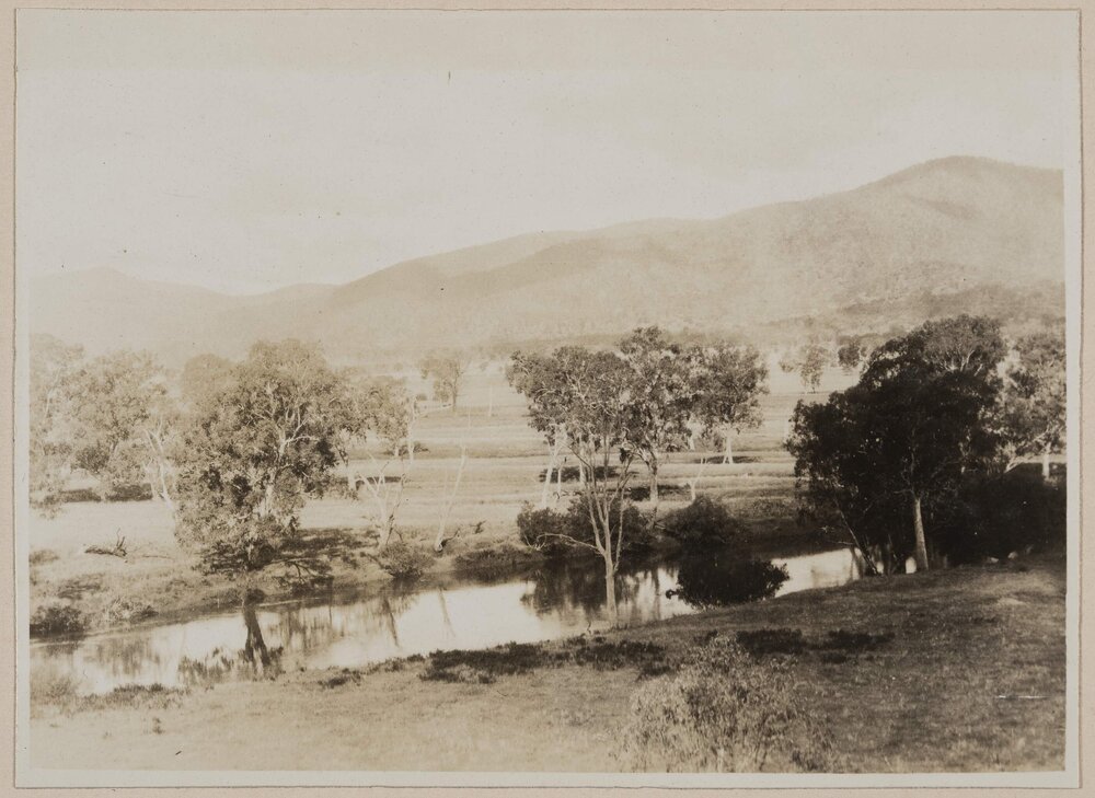 [View of river with mountain in background]
