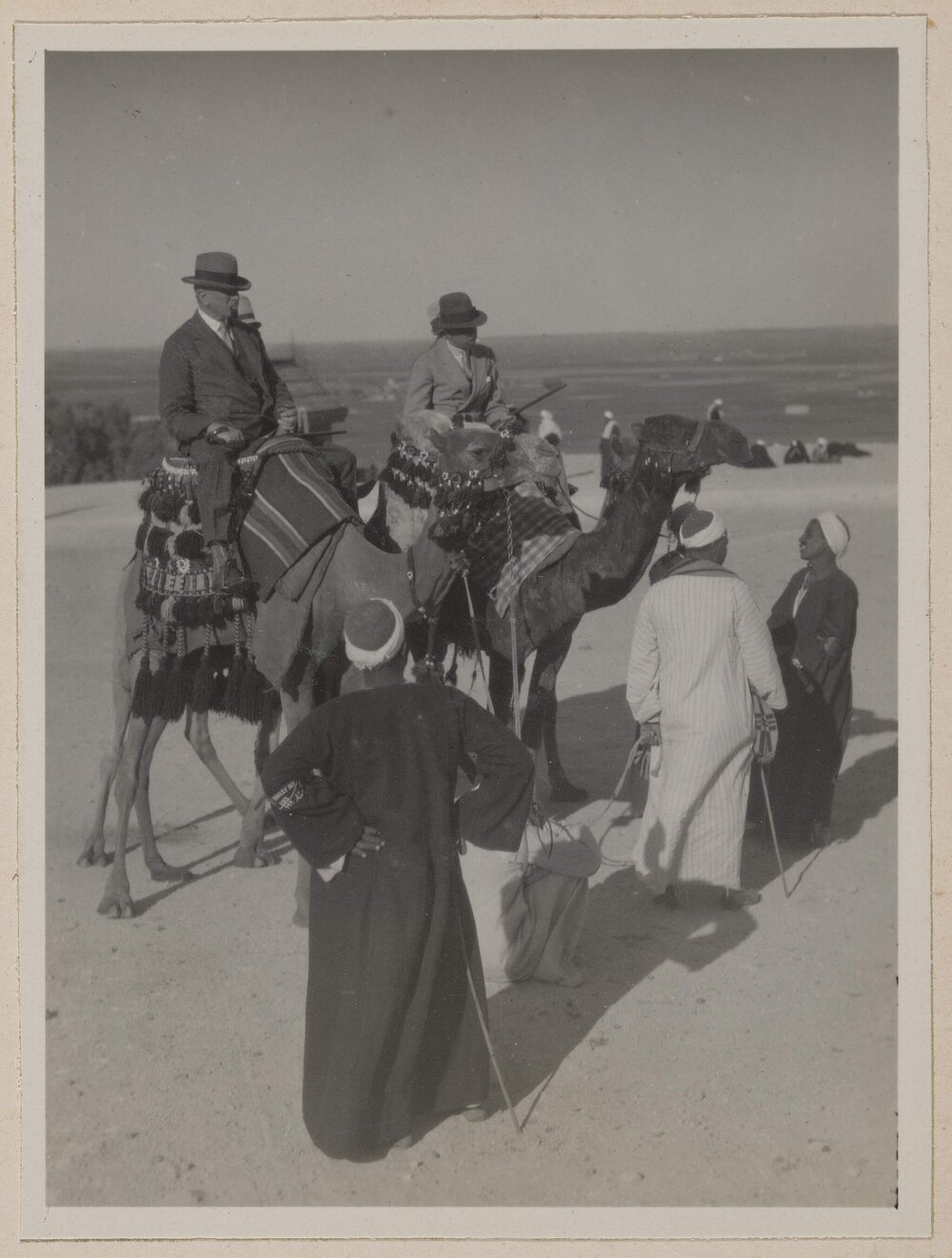 [Man and woman riding camels, Cairo, Egypt]