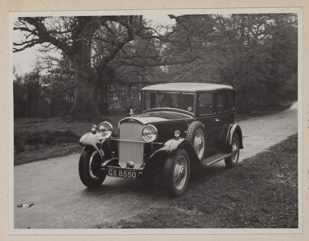 [Woman in motor vehicle]