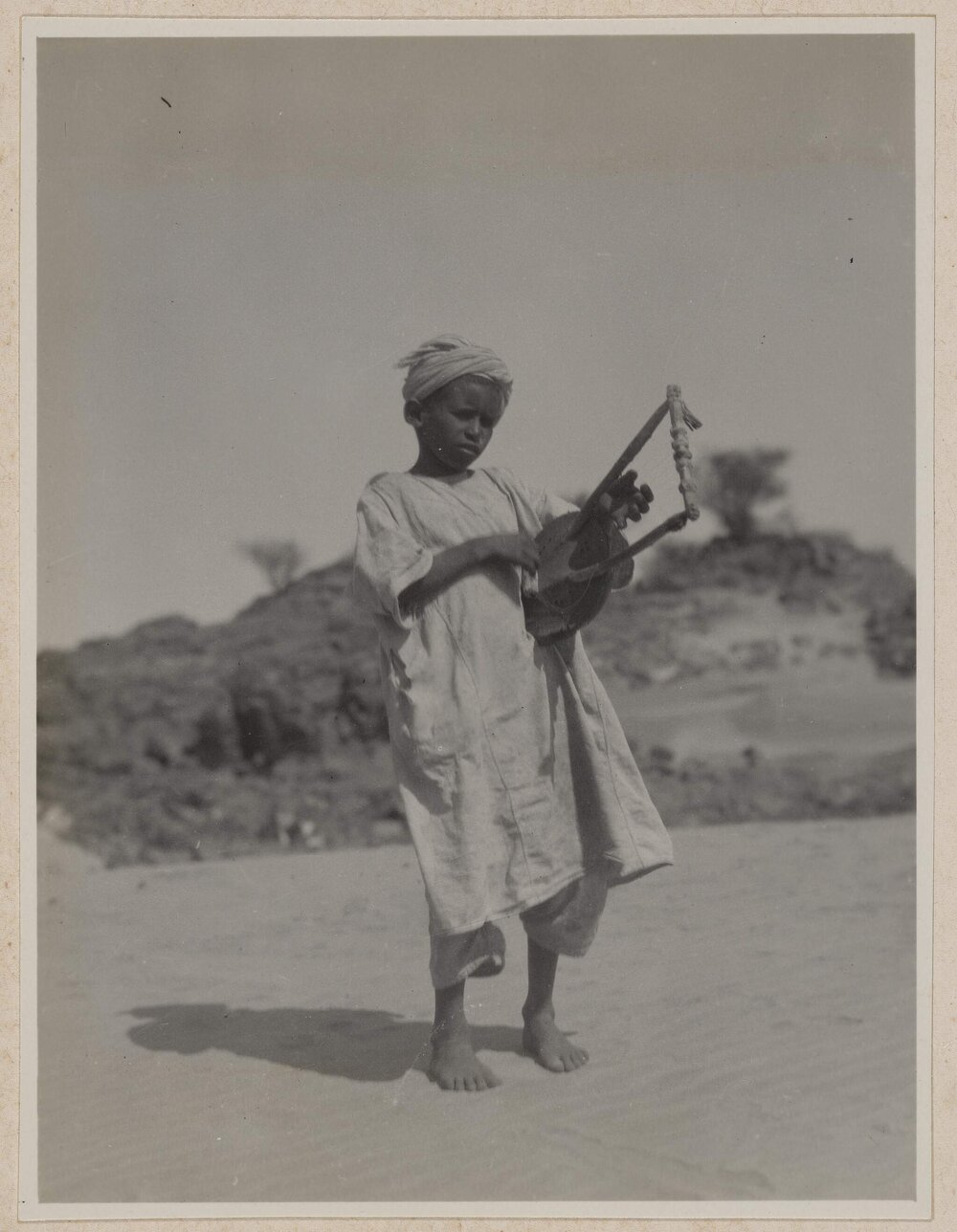 [Child wearing white robe and turban at Abydos]