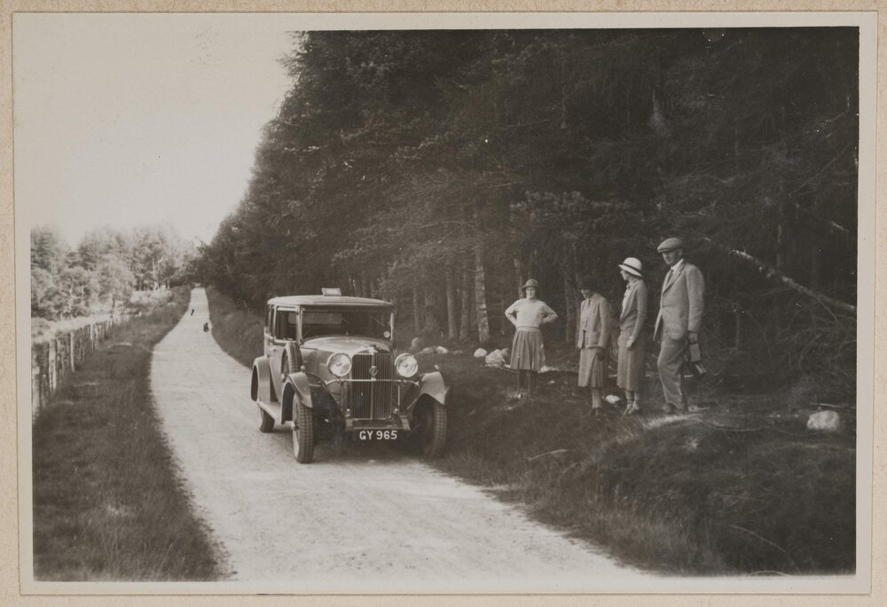 [Group standing next to motor car, Scotland]