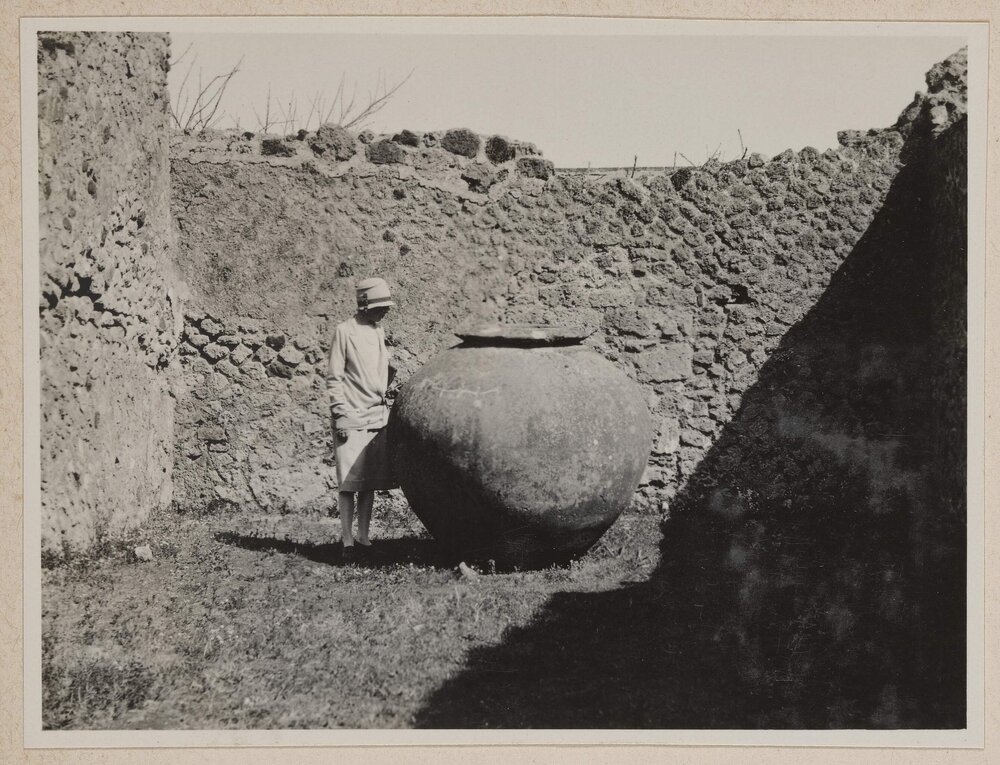 [Mabel Grimwade viewing large urn,]  Pompeii