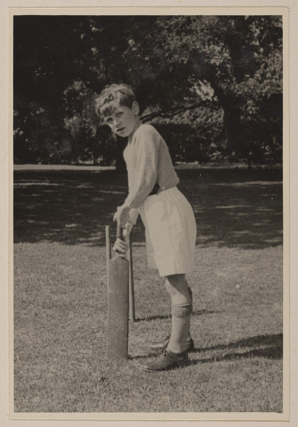 [Boy posed with cricket bat,] Miegunyah