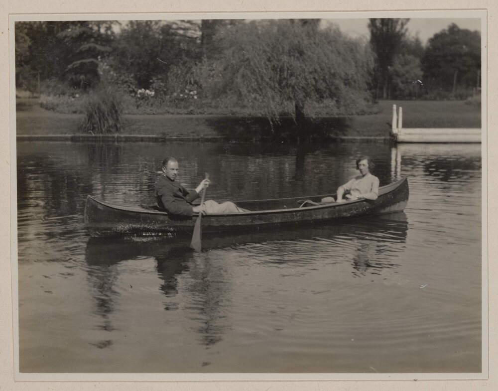 [Man and woman in canoe]