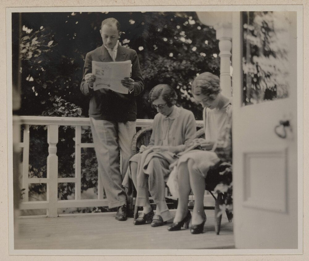 [Man and two women on verandah,] The Islands
