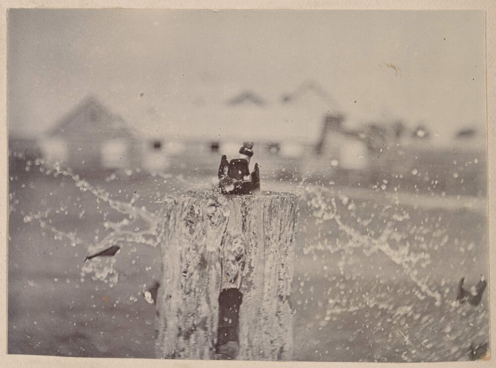 Bottle of water smashed  by a bullet