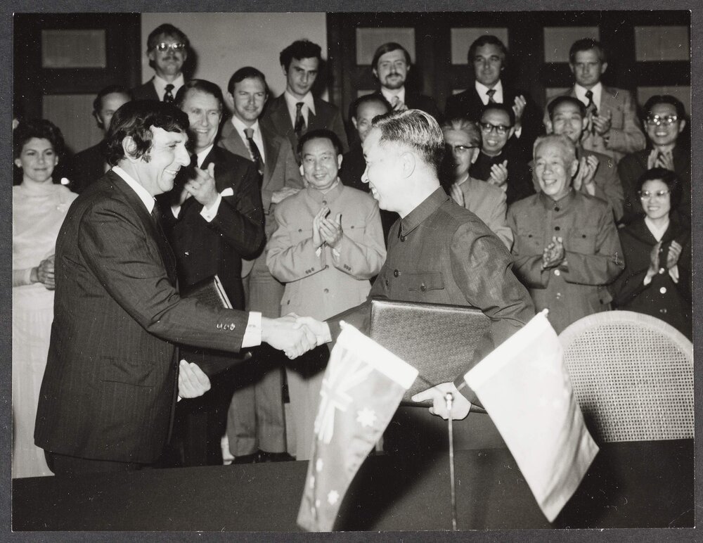 [Unknown people at a signing ceremony in China]