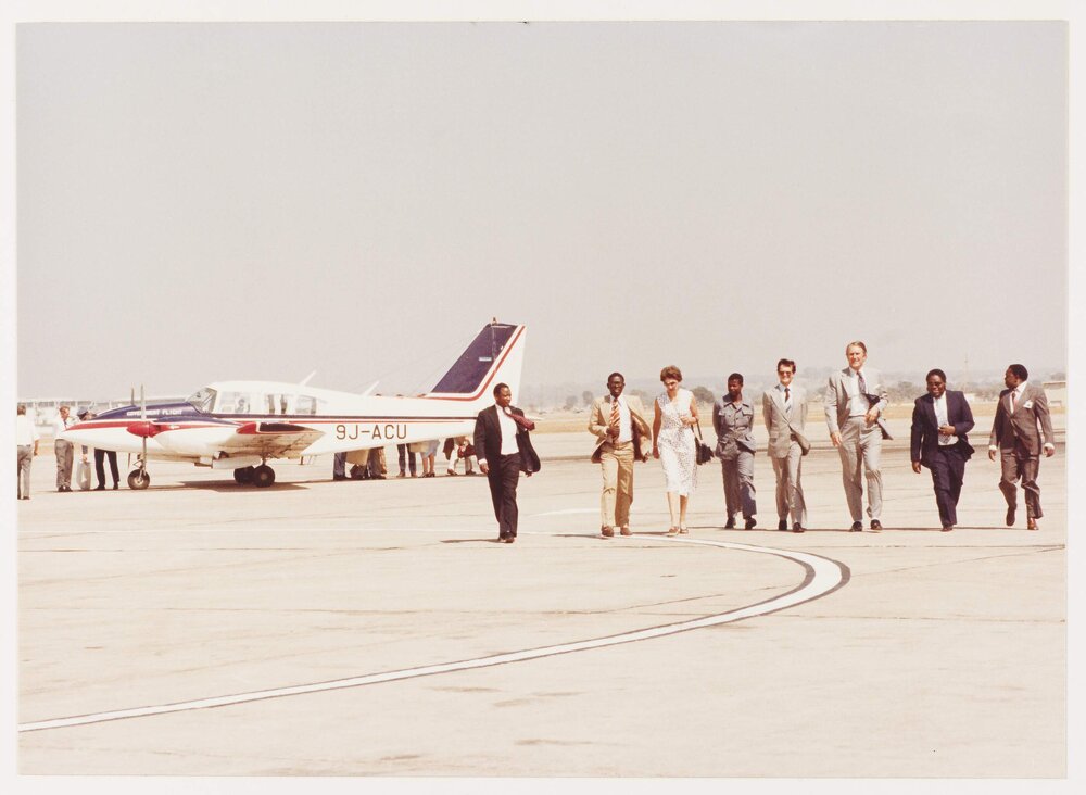 [Tamie and Malcolm Fraser and others at an airport in Lagos, Nigeria]