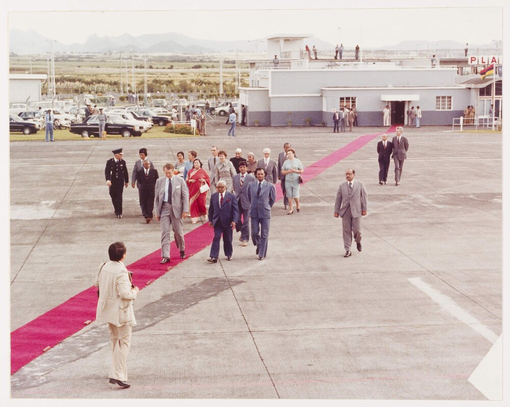 [Malcolm and Tamie Fraser and others at an airport]