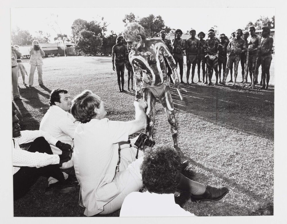 [Malcolm Fraser shaking hands with an unidentified Aboriginal Australian man in traditional dress, during a visit to the Northern Territory]