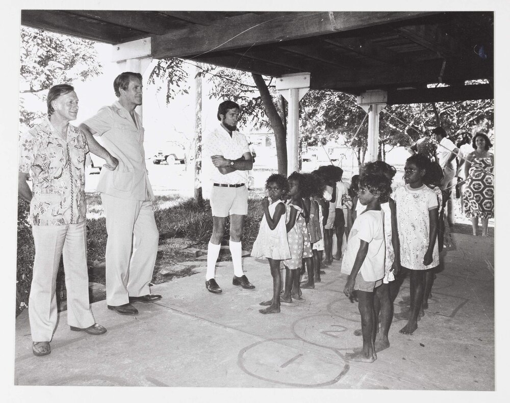 [Malcolm Fraser and other men with Aboriginal Australian children during a visit to the Northern Territory]