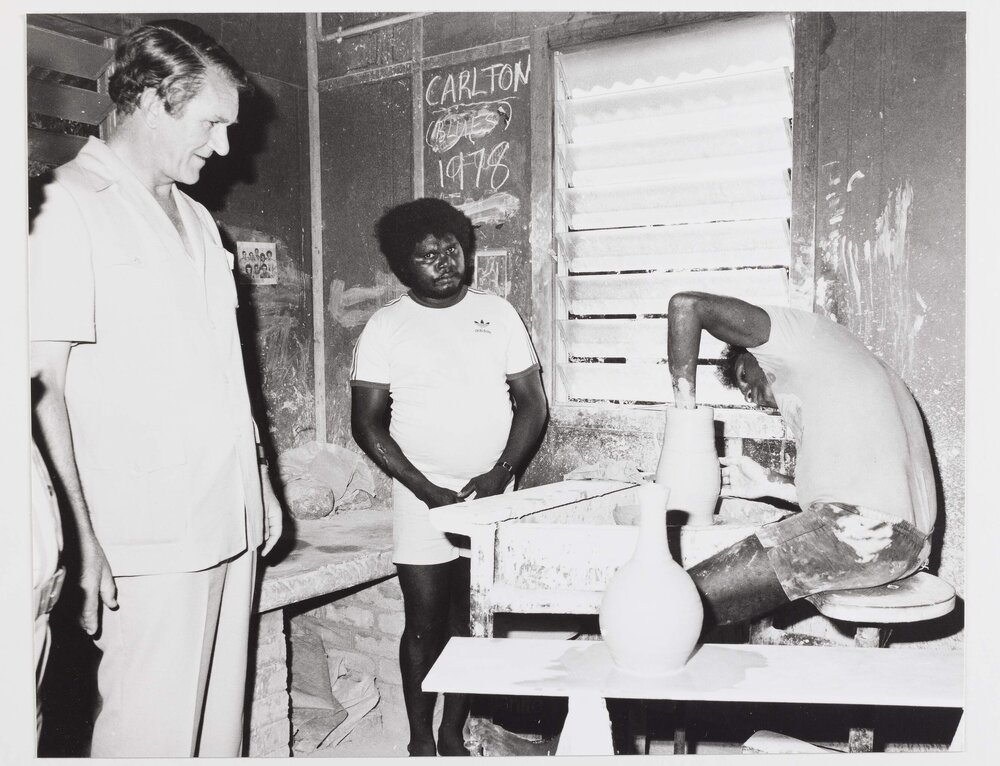 [Malcolm Fraser and two unidentified Aboriginal men engaged in pottery during a visit to the Northern Territory]