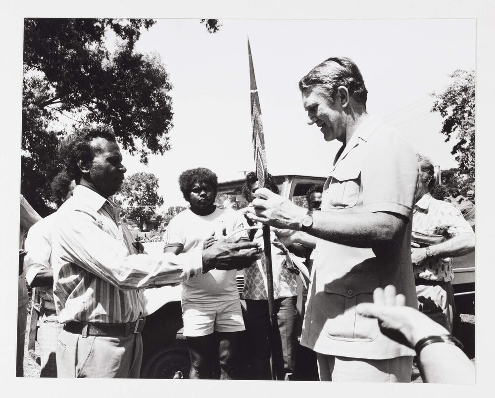 [Malcolm Fraser being presented with gifts by unidentified Aboriginal Australian men during a visit to the Northern Territory]