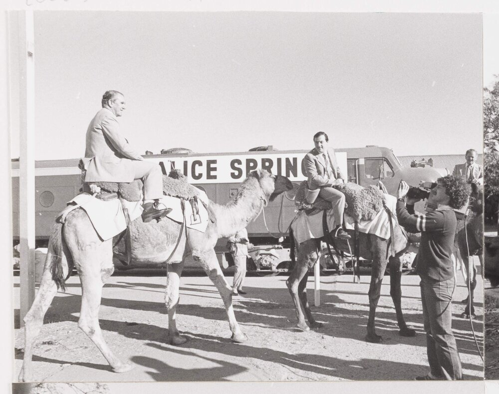 [Malcolm Fraser riding a camel in Alice Springs]