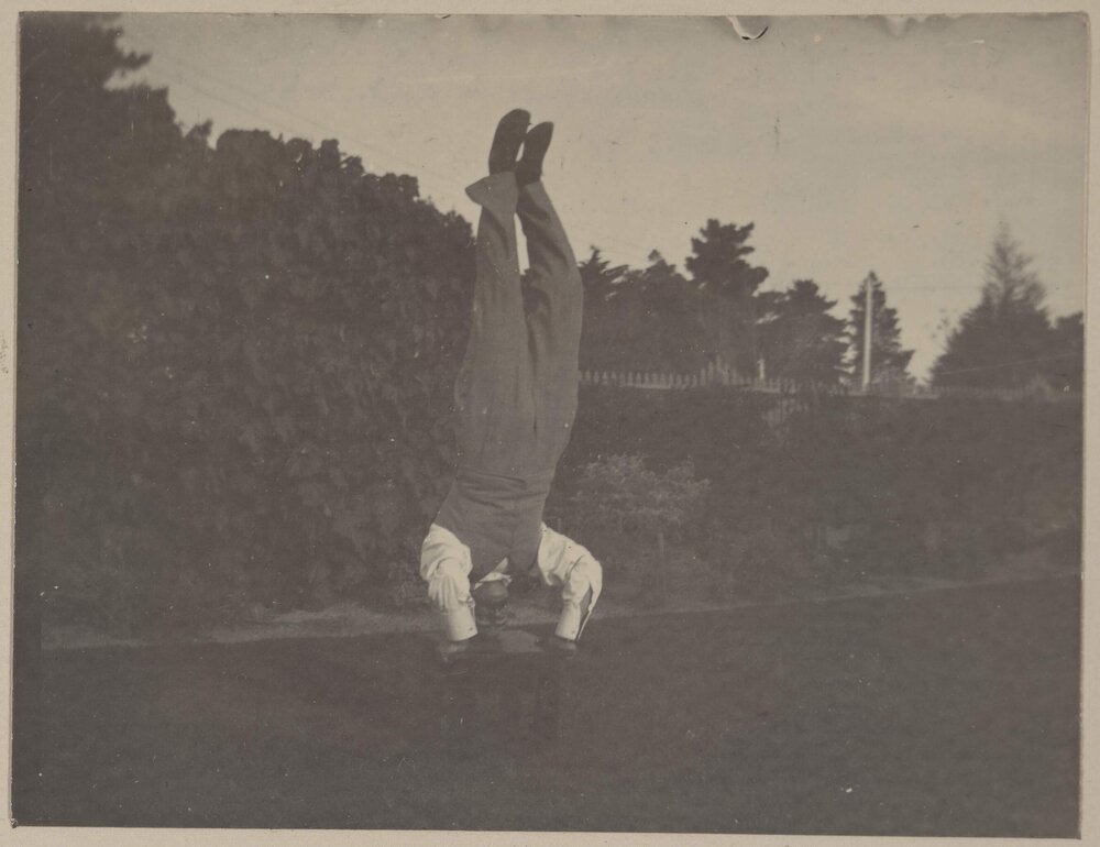 [Man doing hand stand]