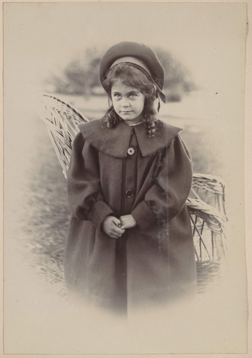 [Young girl wearing smock style coat with beret]