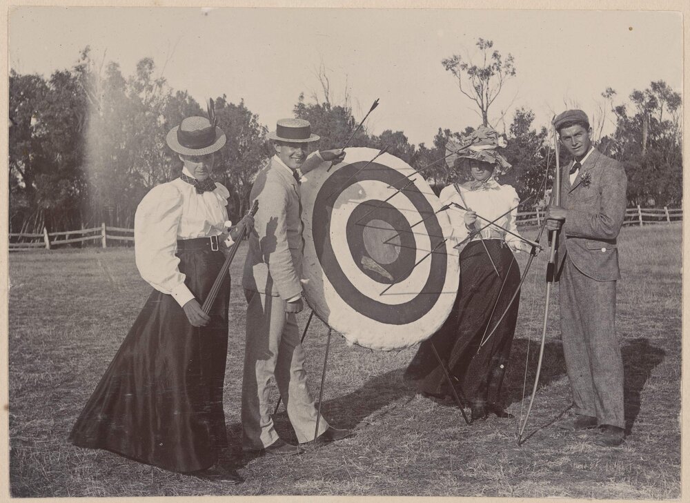 [Two men and two women with archery target] 