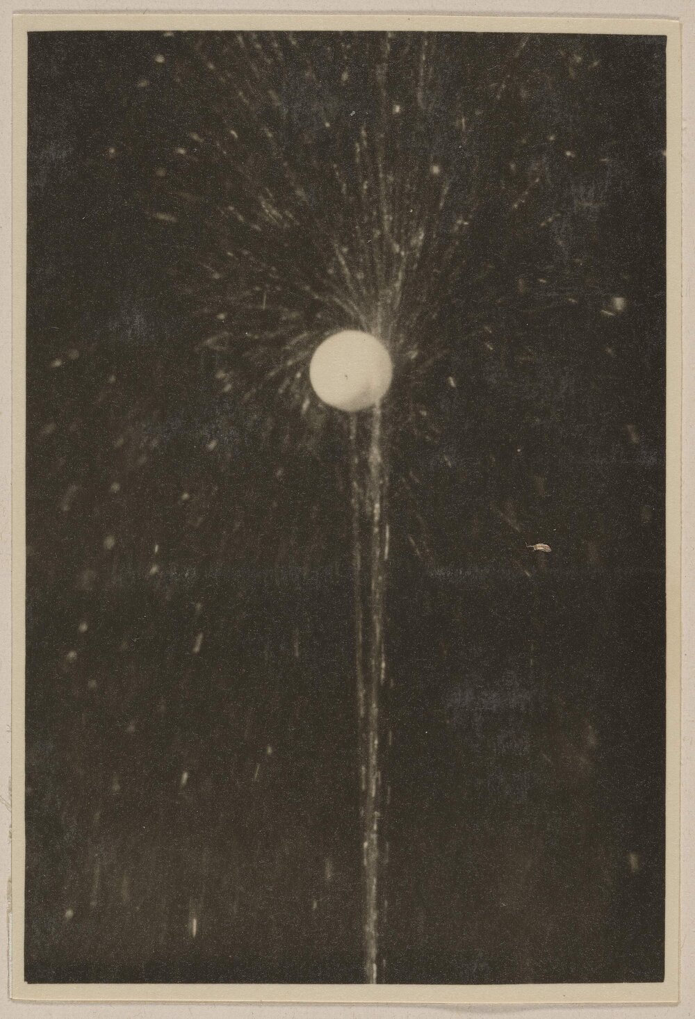 [Action shot of spouting water and airborne ball ]