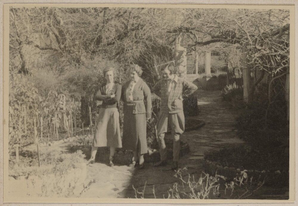 [Women posed in gardens with a vine arbour,] Carabost [New South Wales]