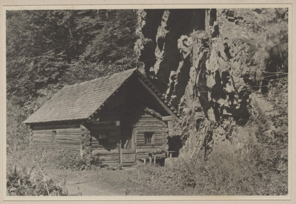 [Wooden cabin next to rock face, Austria]