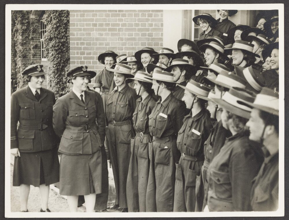 [Photograph: Margaret Blackwood and another WAAAF officer inspecting group of women in uniform]