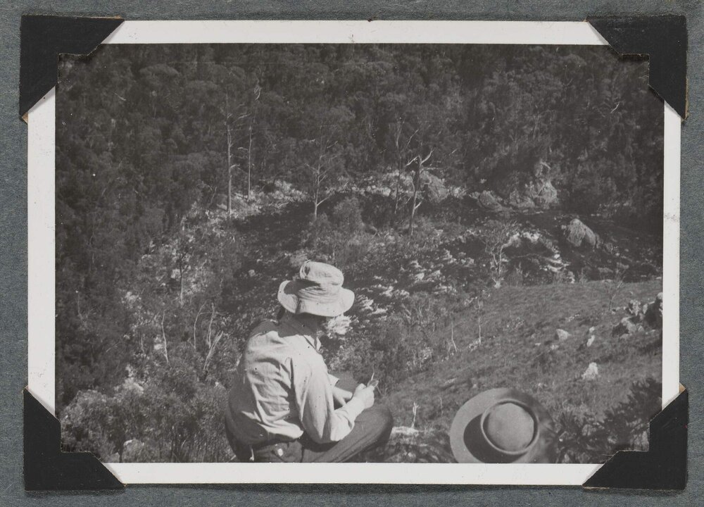 [Mountaineering Club Tasmania trip - woman seated in a foreground]