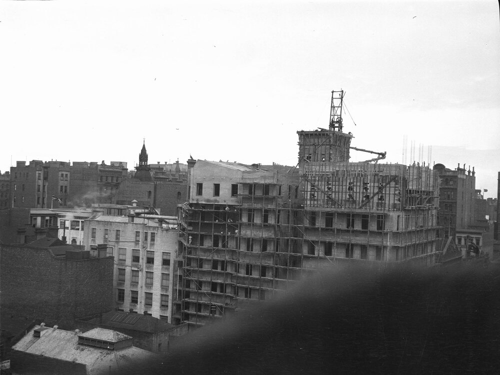 General view of Collins House taken over roof tops. Collins St., Melbourne