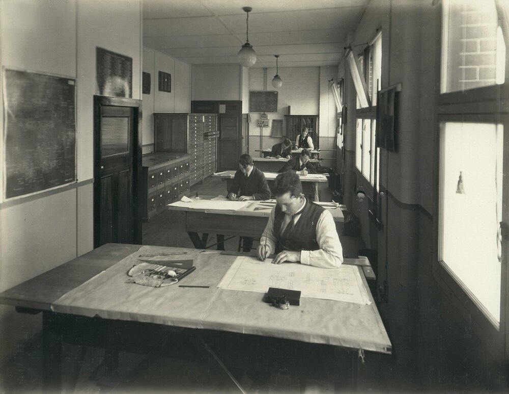 Staff working at drafting tables in the Engineers Workshop, Drawing and Designing Section, at Foy and Gibson Pty. Ltd. Gibsonia Mills in Collingwood, Victoria.