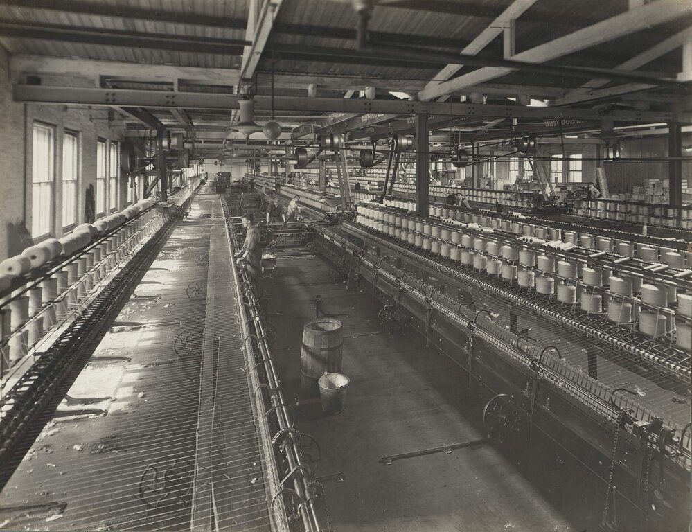 Men operating worsted wool spinning machinery at Foy and Gibson Pty. Ltd. Gibsonia Mills in Collingwood, Victoria.