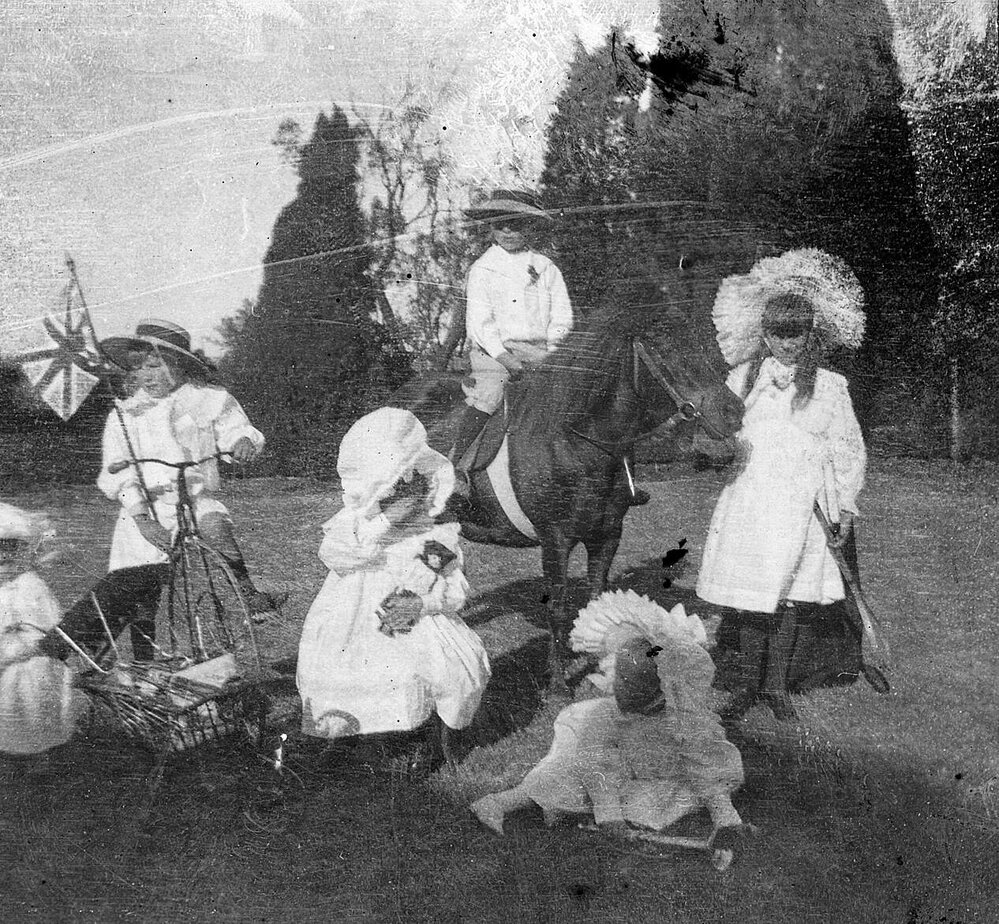 Photo of children playing on lawn