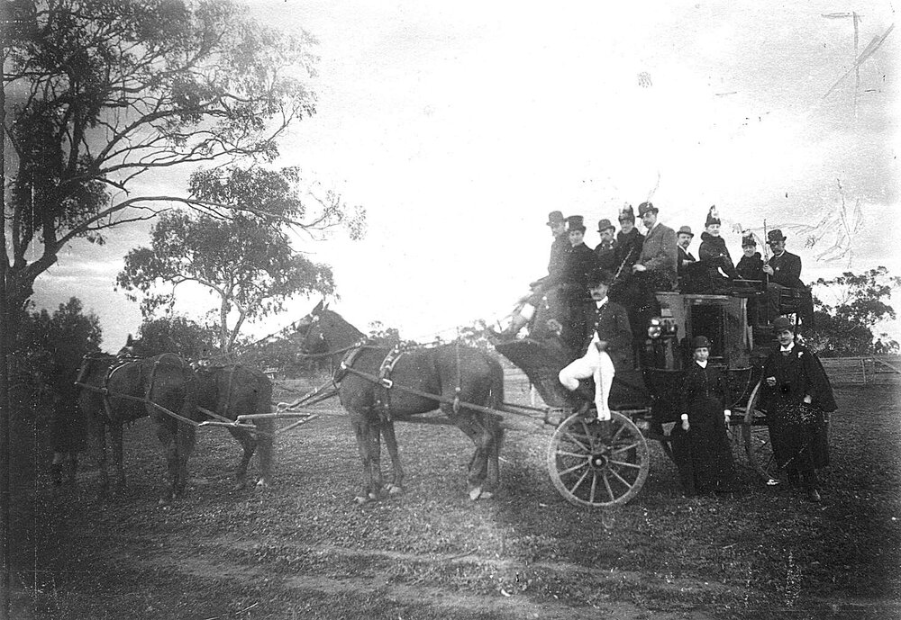 A horse drawn wagon and passengers