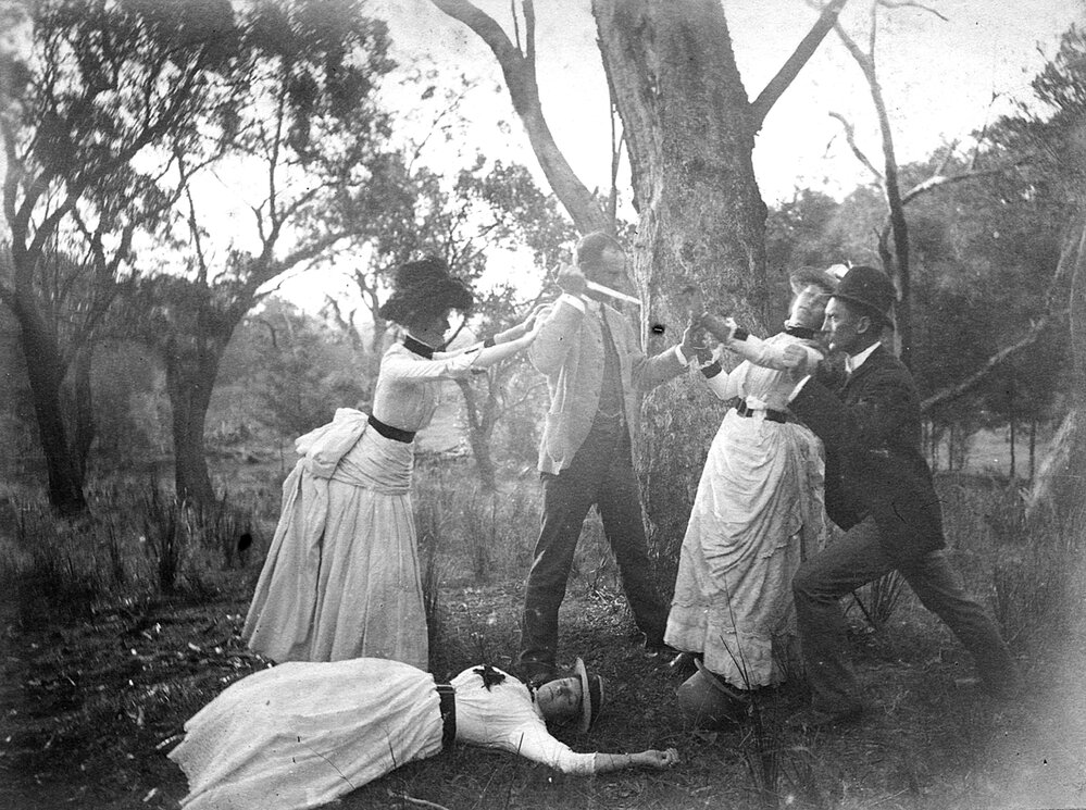 A group of people posing outdoors.