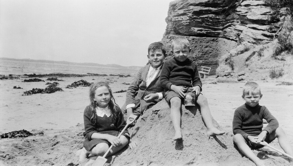 Four children at a beach