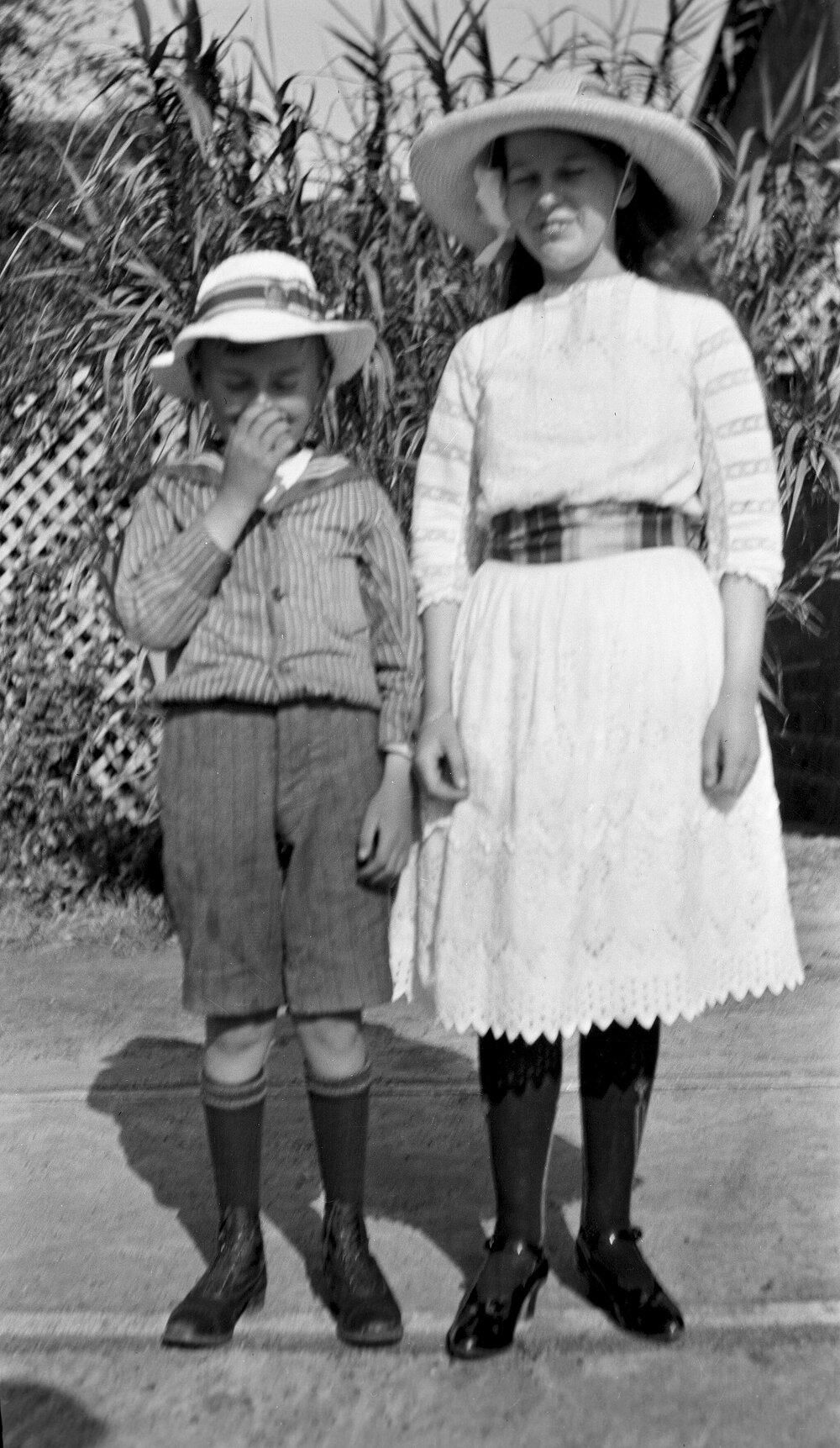 Portrait of boy and girl at Glenmoore garden, Elsternwick