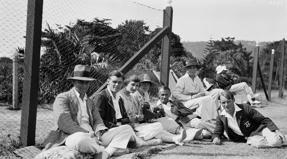 Group of people near wire fence