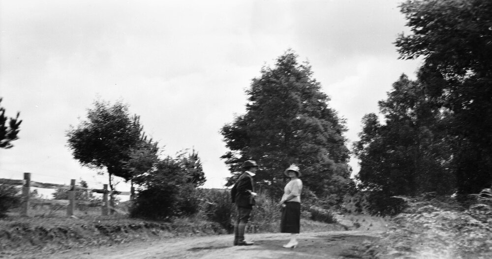 Two people on country road
