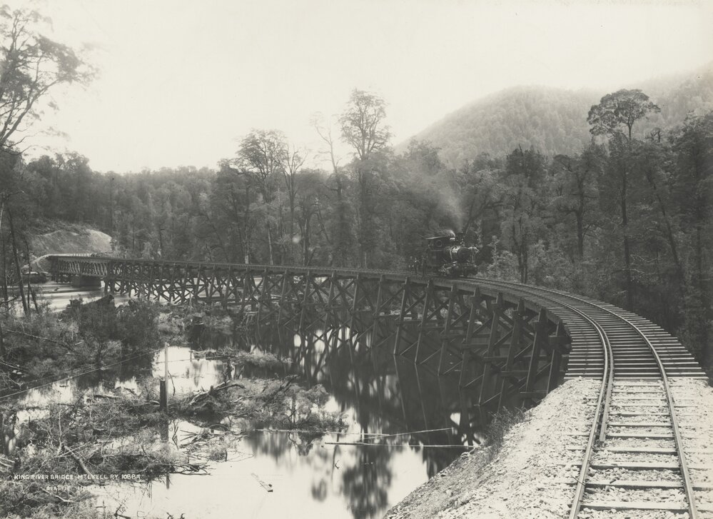 A view of a timber trestle railway bridge crossing the King River, Tasmania, constructed by Mount Lyell Mining and Railway Co. Ltd.