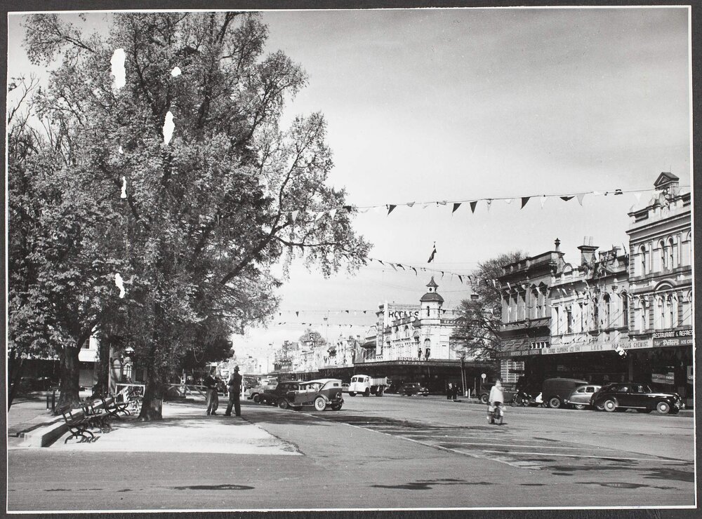 Busy street with commercial buildings, city of Goulburn.