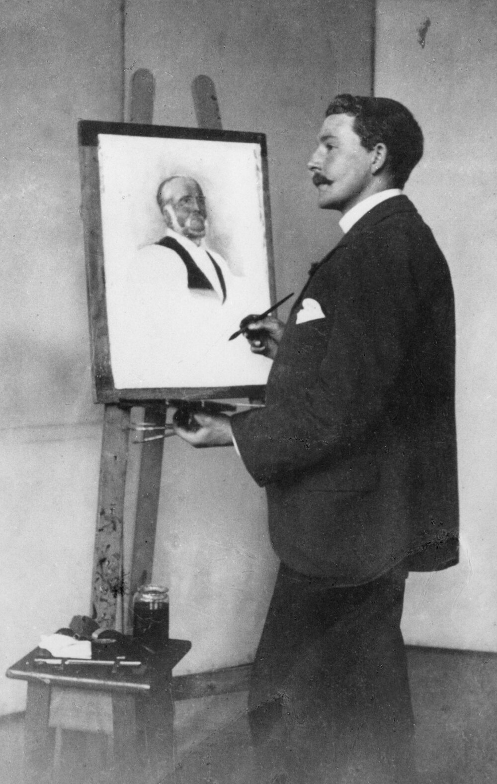 Walter Bennett standing at the easel