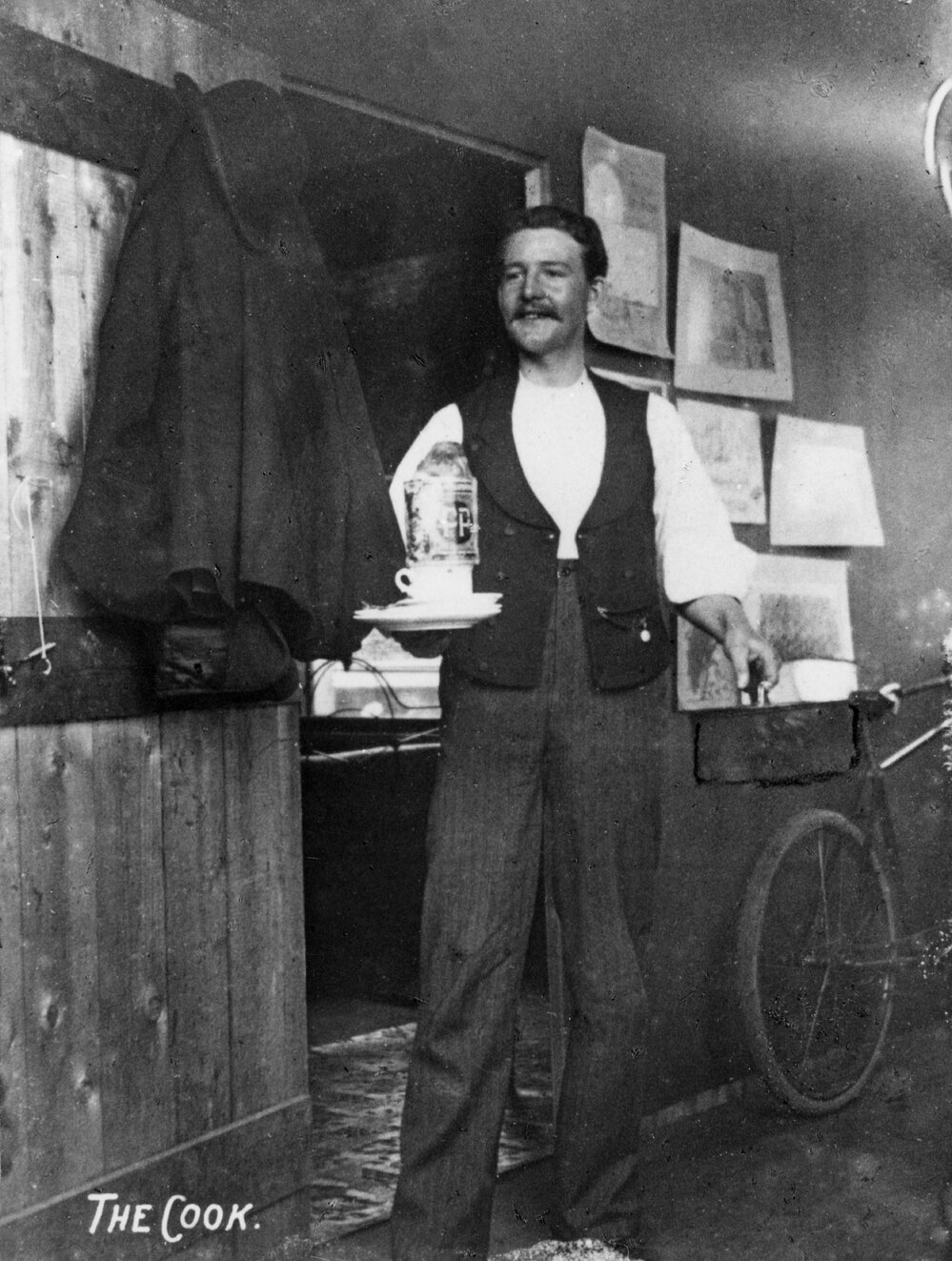 Walter E Bennett carrying tea in a studio in Sydney